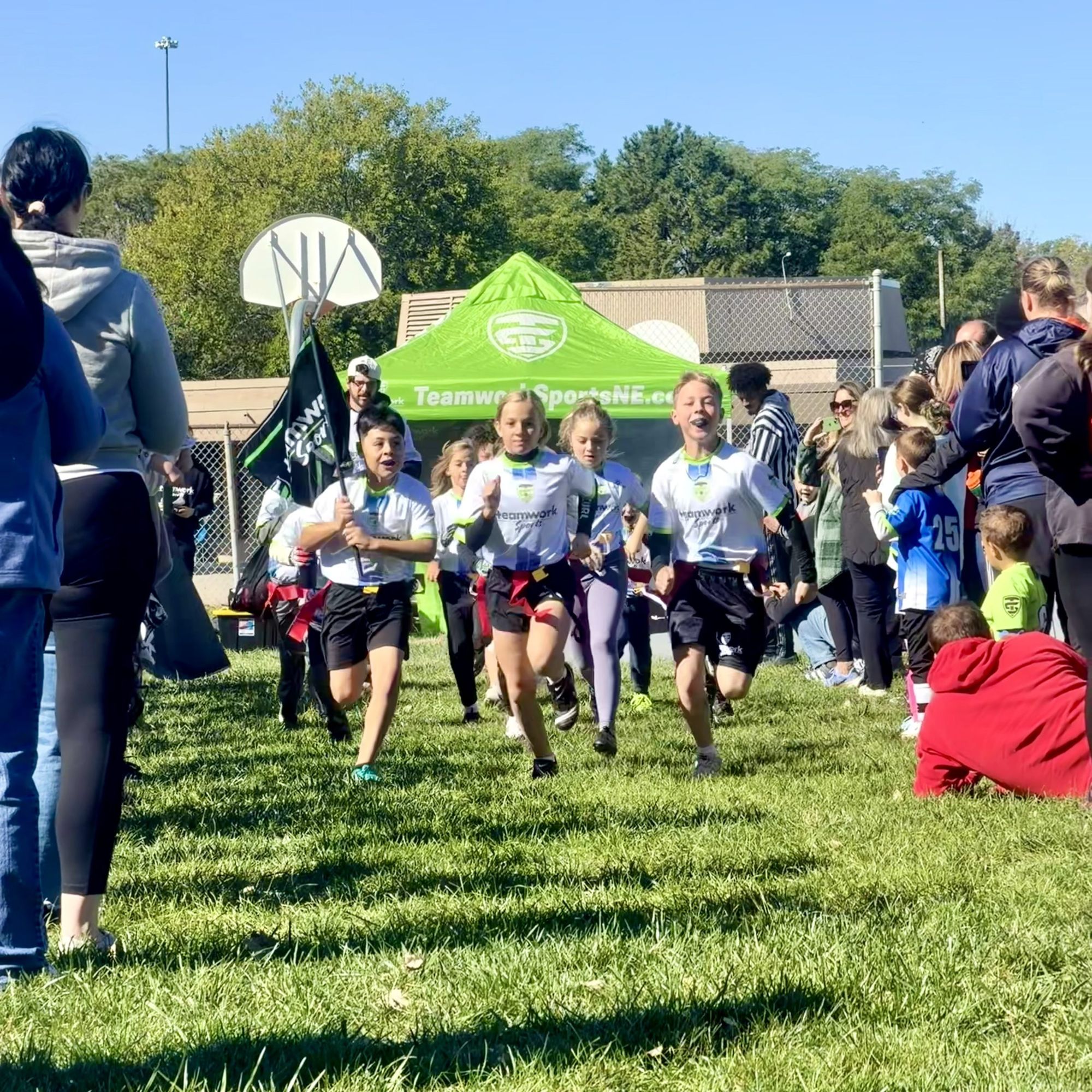 Players running through the parent tunnel on final day