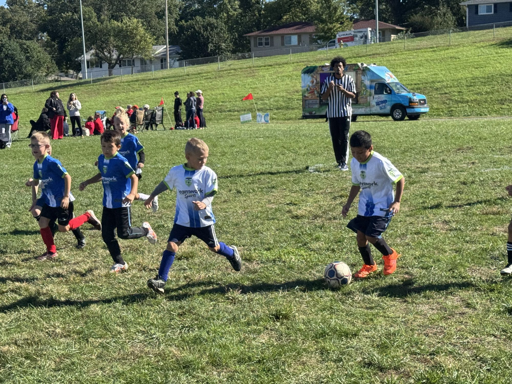 Kids playing soccer at a Teamwork Sports program