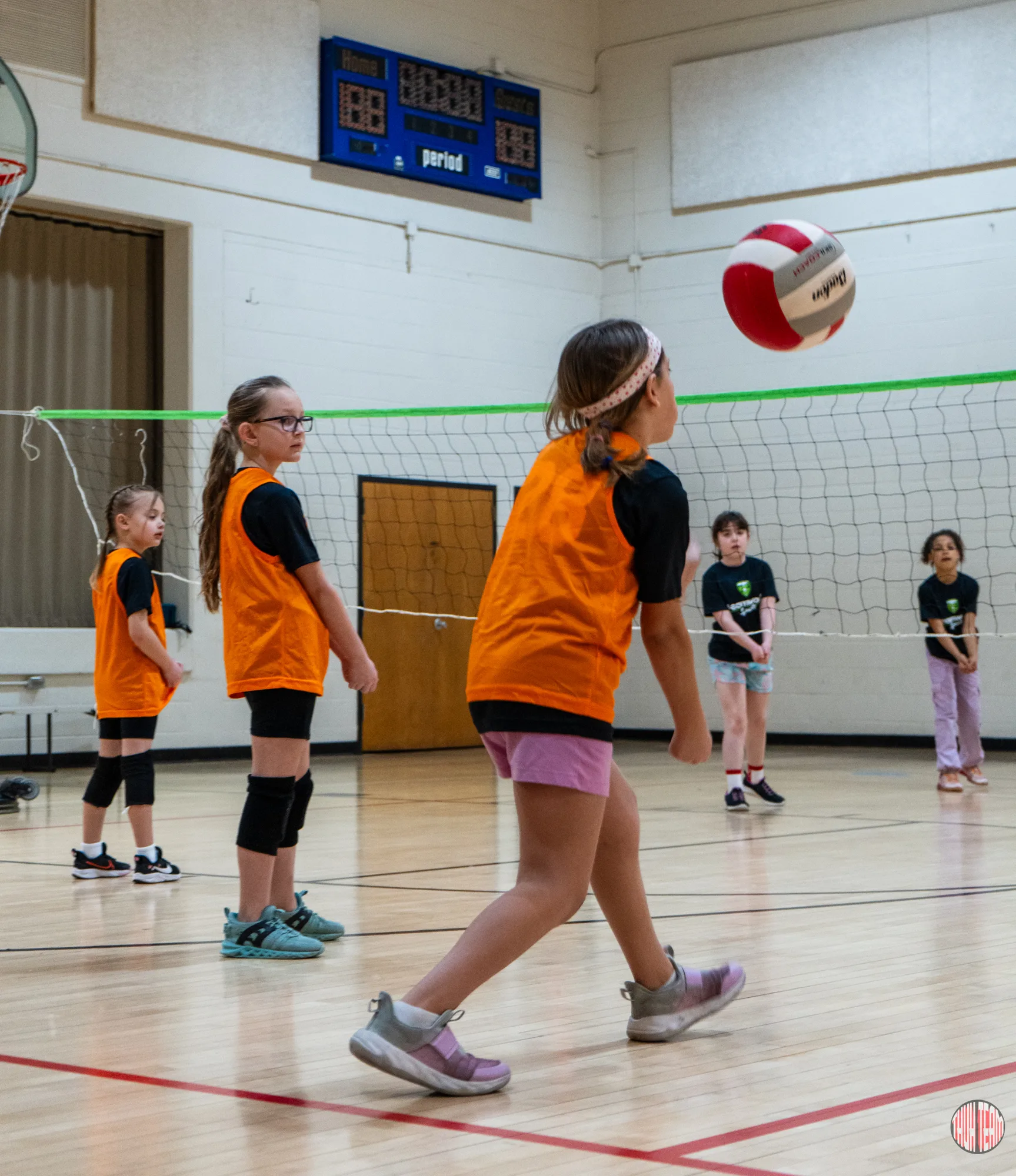 Volleyball players waiting for the serve at the net